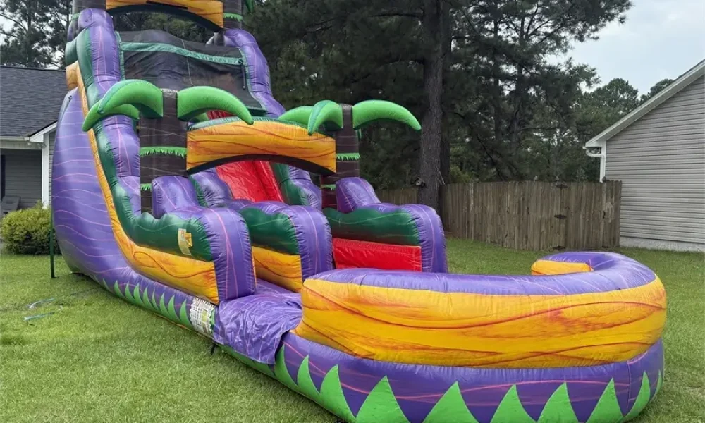 Jamaican Plunge inflatable water slide rental set up in a Jacksonville, NC backyard by Elevation Inflatables