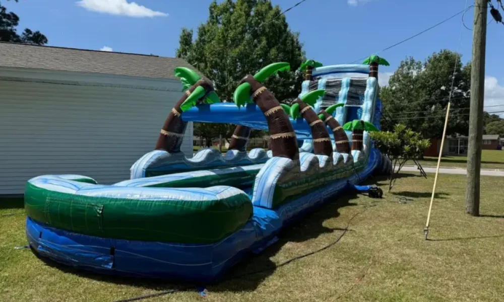 Tropical Tsunami dual lane water slide rental set up in Jacksonville, NC by Elevation Inflatables
